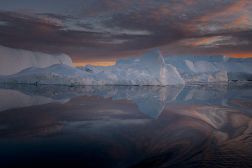 greenland-iceberg-whirpool-colorful-darksea